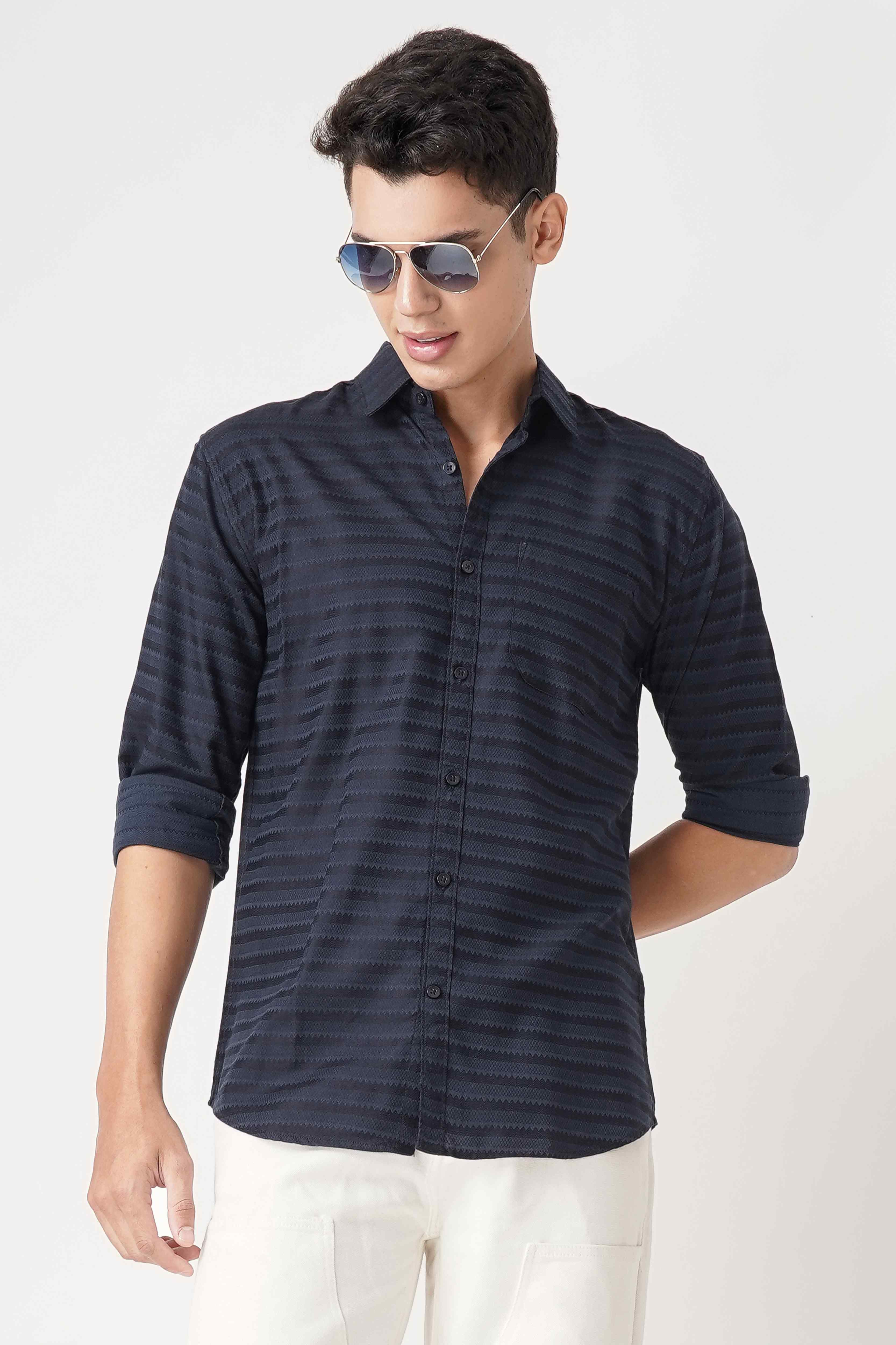 A stylish man wearing a full sleeve shirt