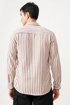 Man wearing Striluxe striped shirt, showcasing timeless striped design and comfortable fit.