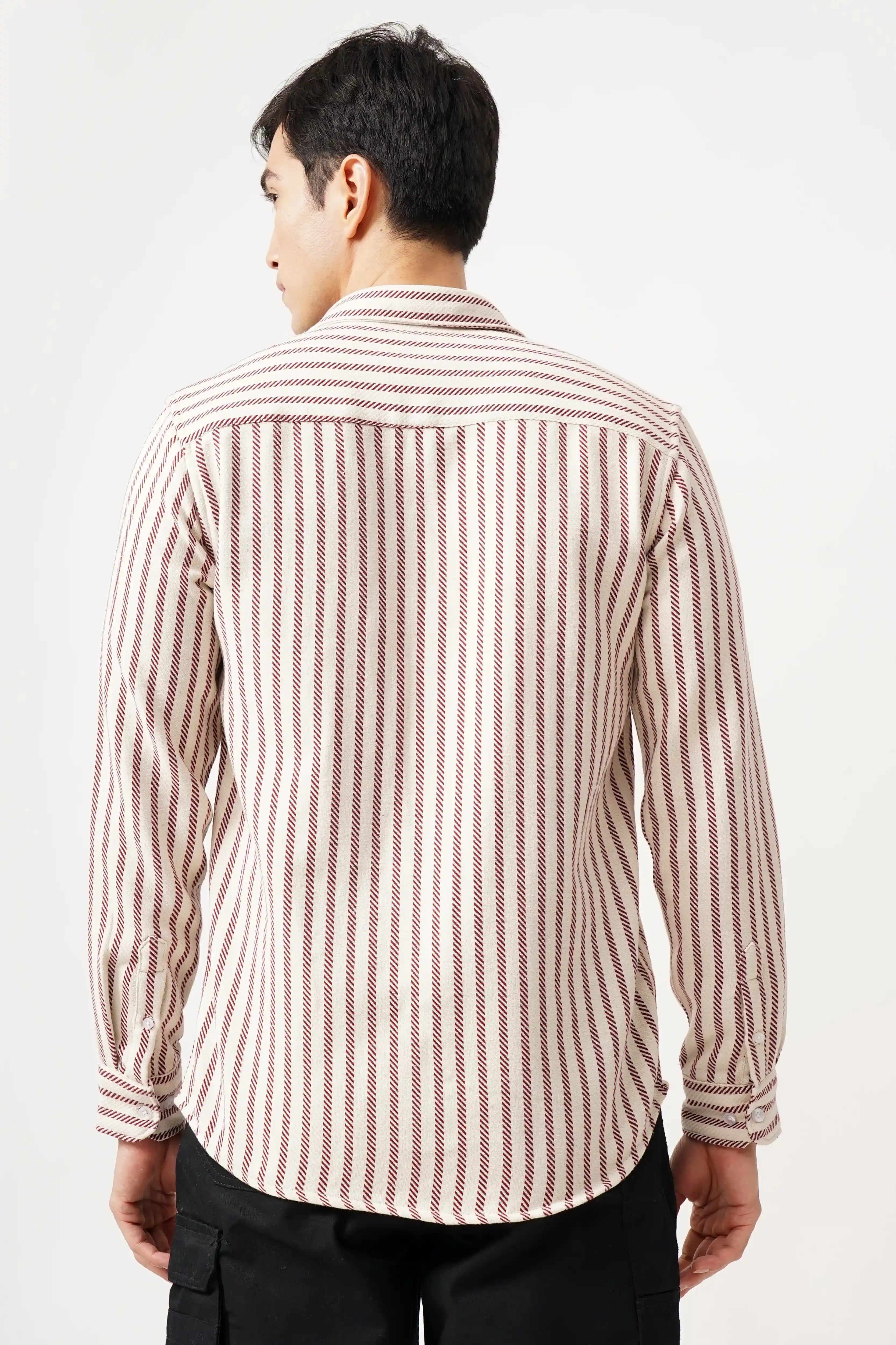 Man wearing Striluxe striped shirt, showcasing timeless striped design and comfortable fit.