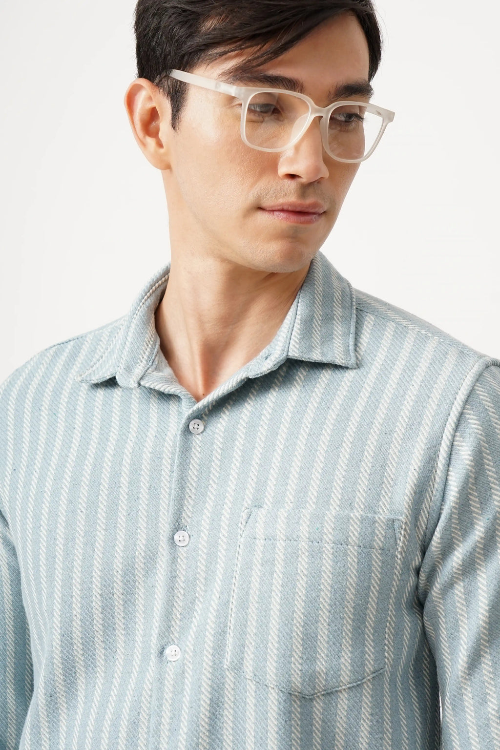 A man wearing an Aqualure striped shirt in premium brush fabric with a comfort fit design.