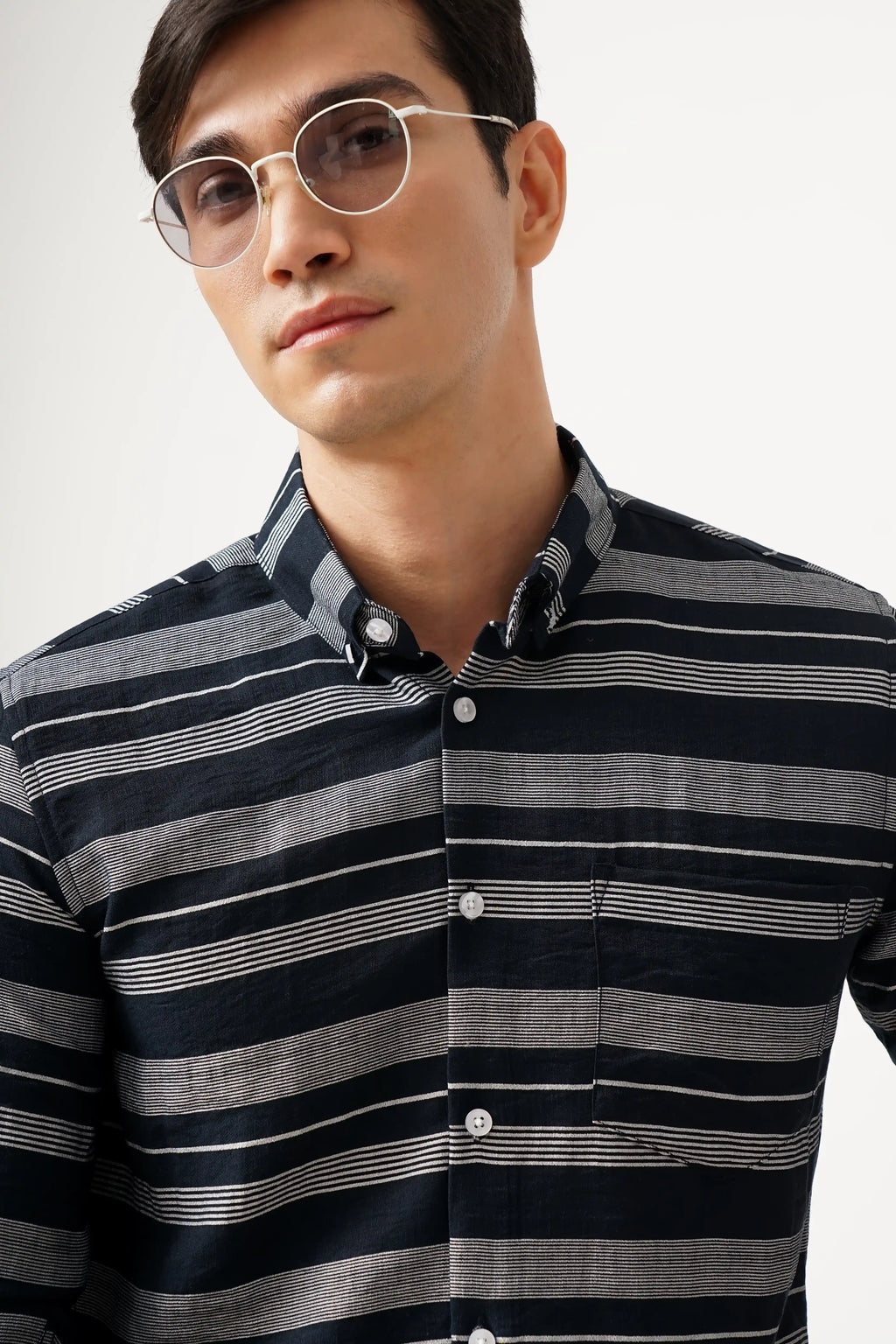 NOIELINE striped shirt with black and grey pattern, crafted from breathable cotton for comfort and style.