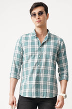 Man wearing BRUMIX CHECK SHIRT with comfort fit and stylish checkered pattern.