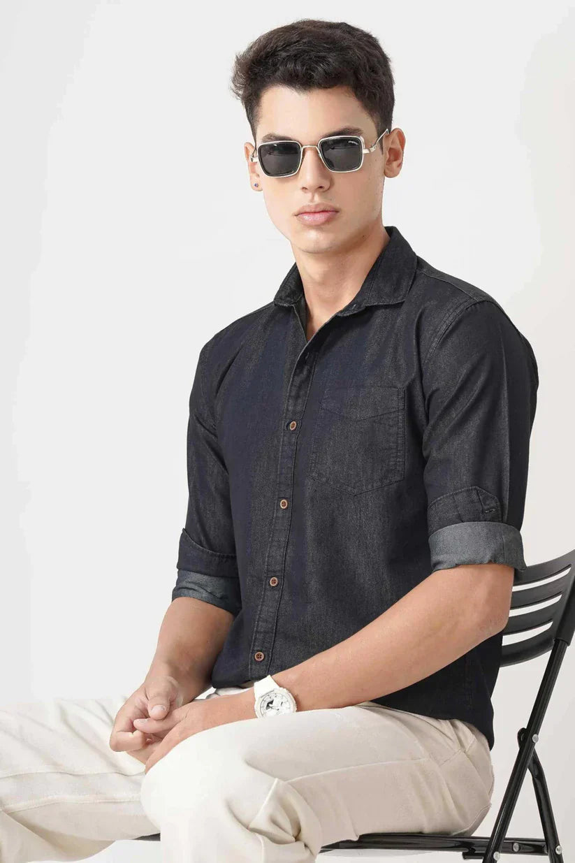 Men's stylish black denim shirt made of cotton for comfort and style.