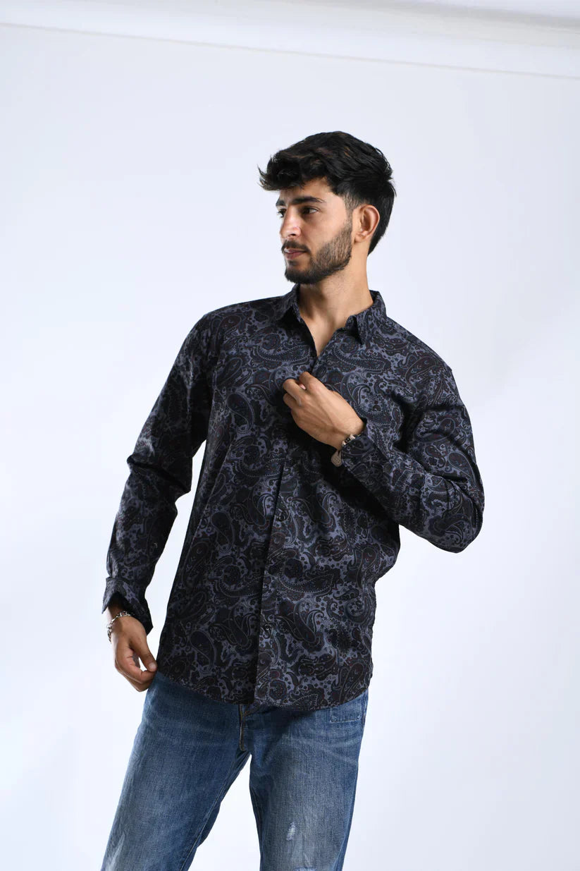 Man wearing a trendy black printed shirt made of 100% cotton.