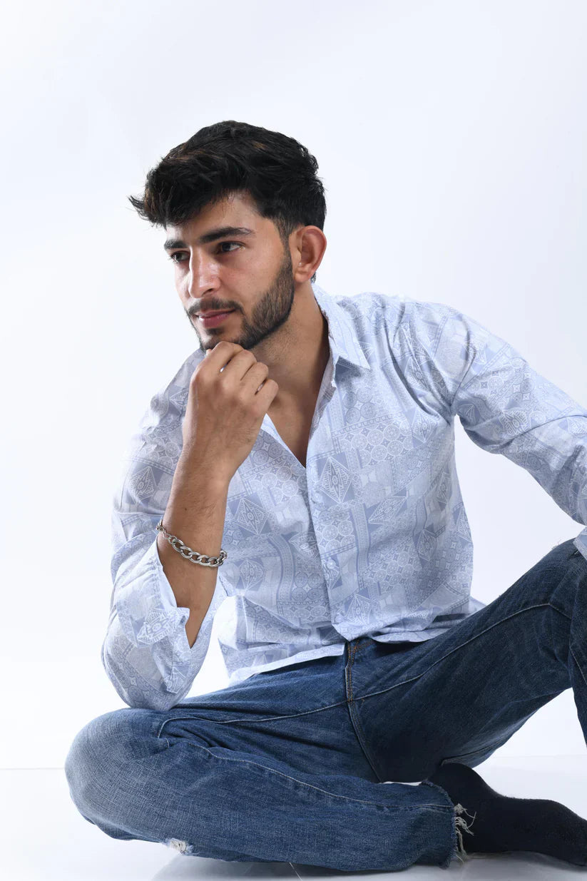 Man wearing stylish blue geometric pattern shirt with cotton blend lycra fabric.