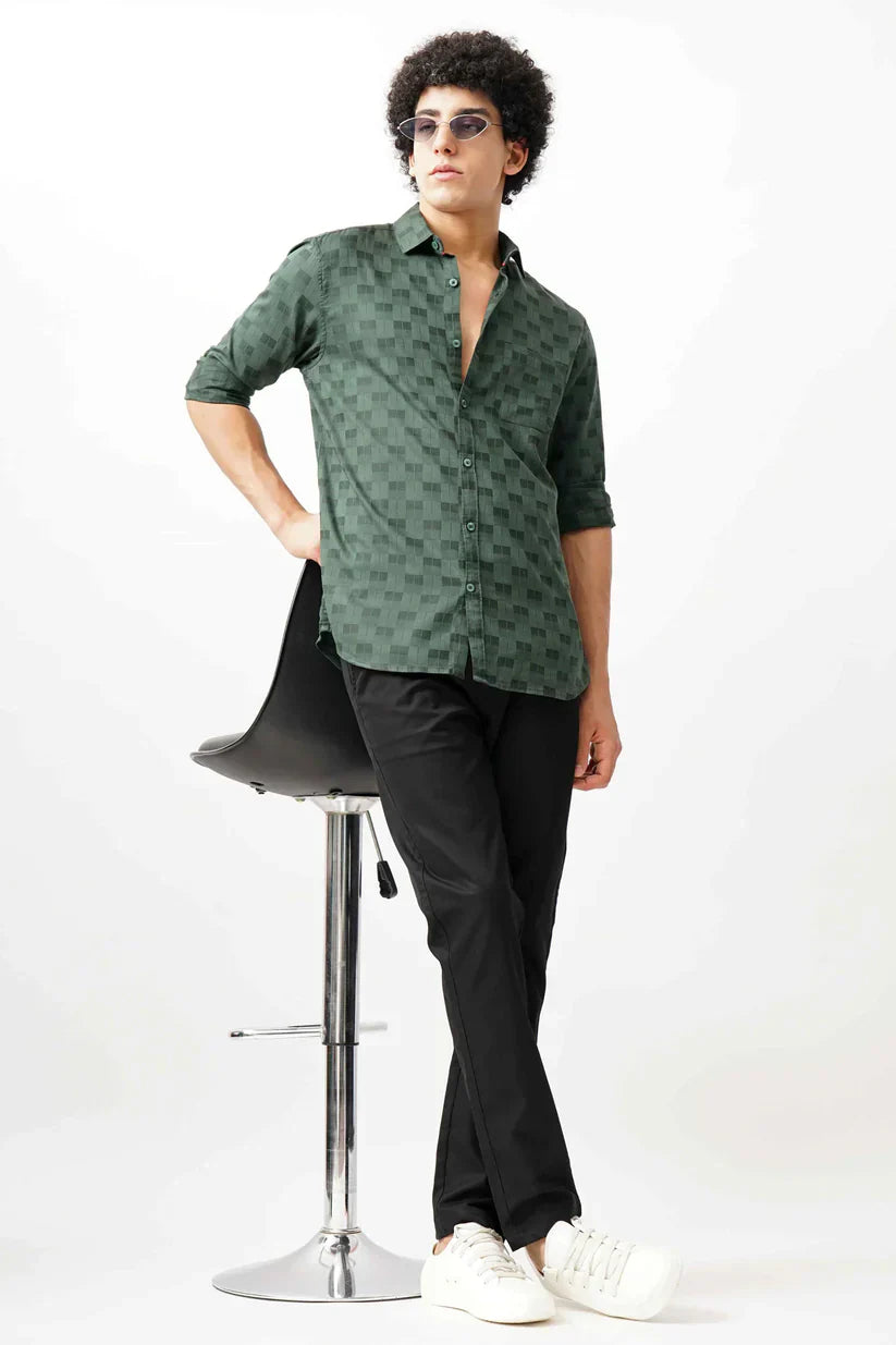 Man wearing a dark green jacquard shirt with premium comfort.