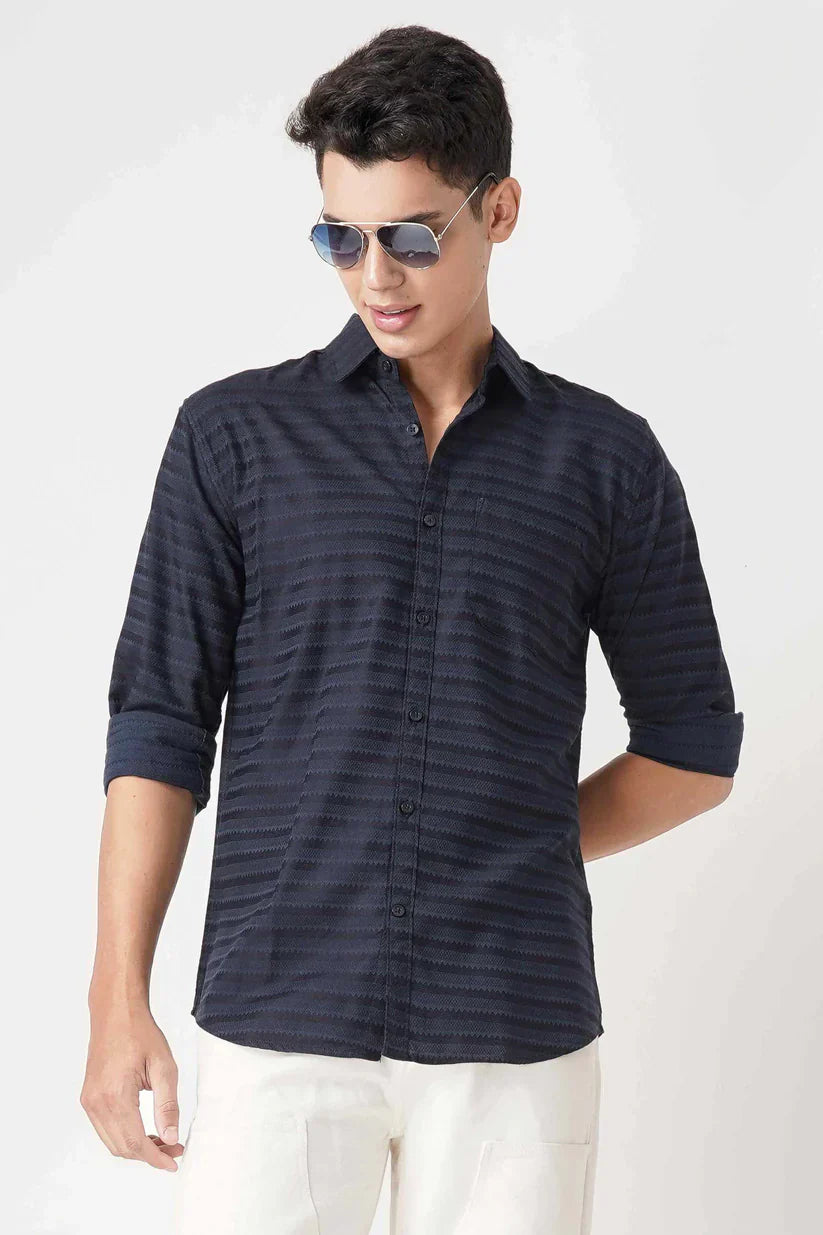 Navy blue striped shirt for men made from cotton blend fabric.