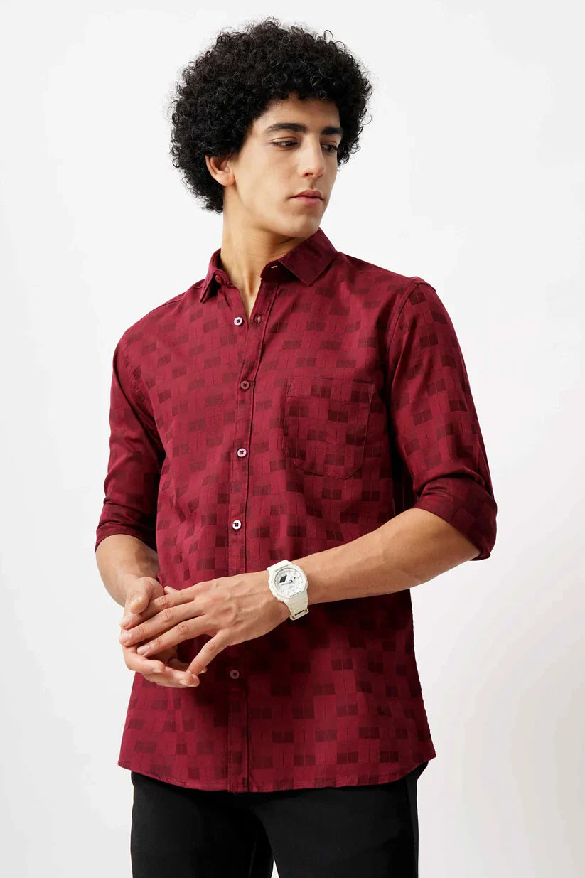 Man wearing red jacquard shirt with classic design and premium comfort.