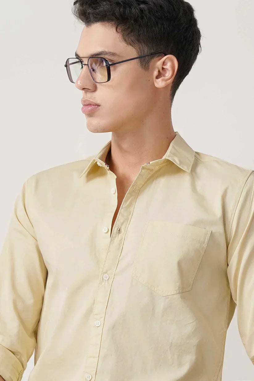 Man wearing an Amber Glow Shirt with a warm golden hue.