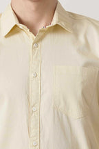 Amber Glow Shirt for men, vibrant yellow, long sleeves, button-up with pocket.