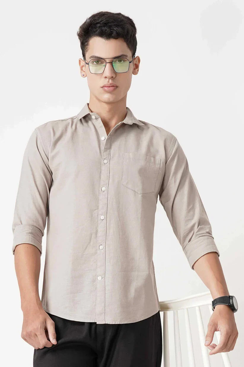 Beige linen shirt with long sleeves.