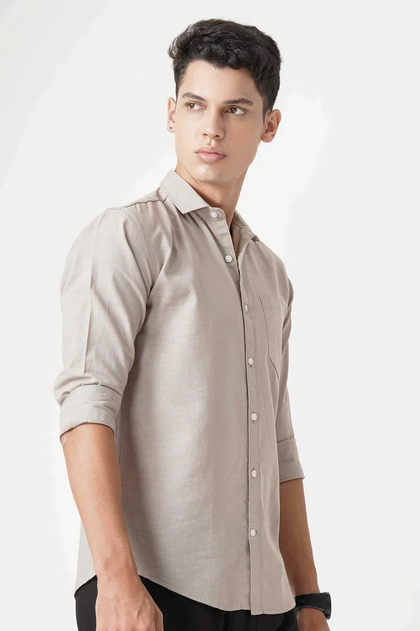 Beige linen shirt worn by a model.