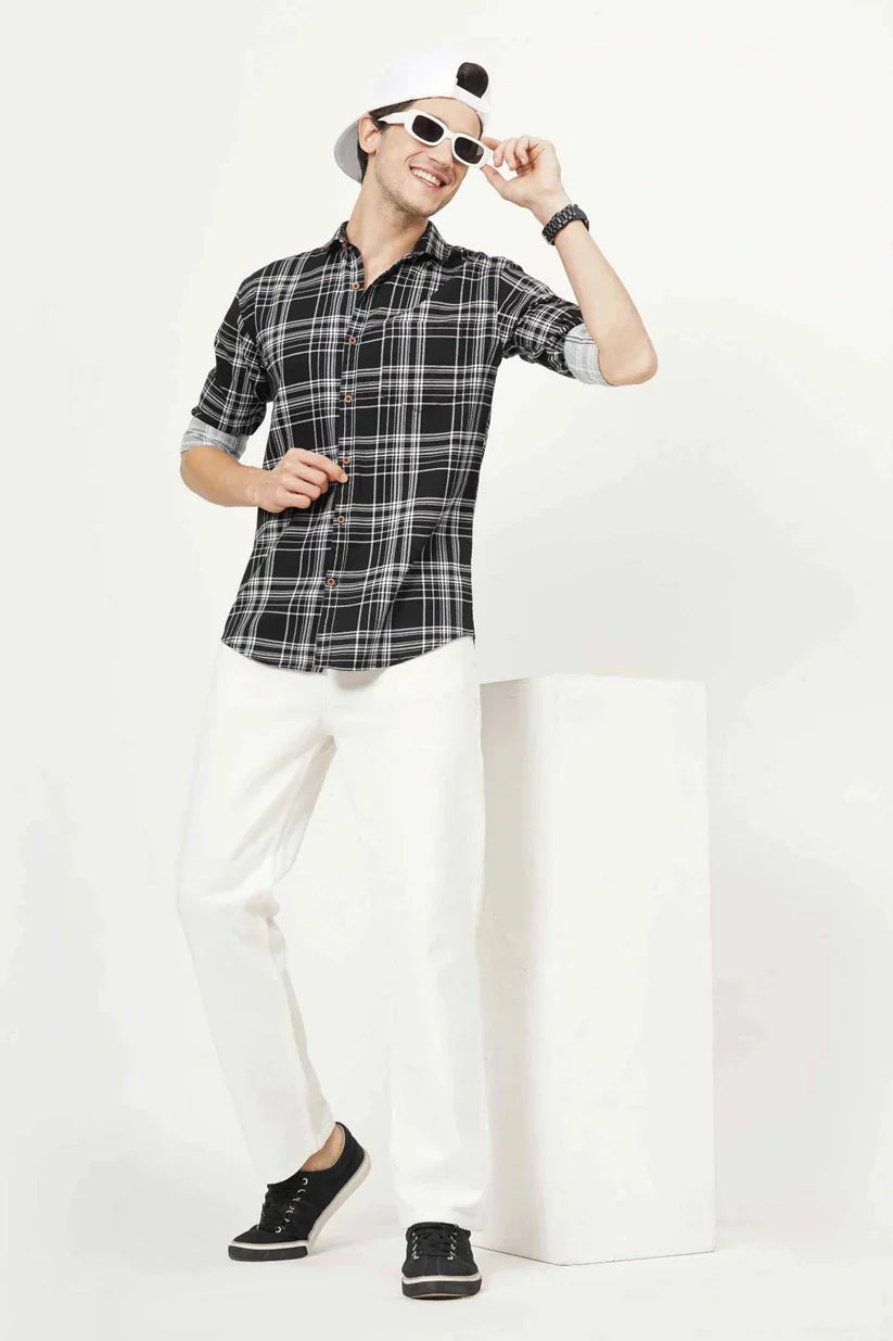 Man wearing a stylish black checks shirt with white lines, 100% cotton, perfect for any occasion.