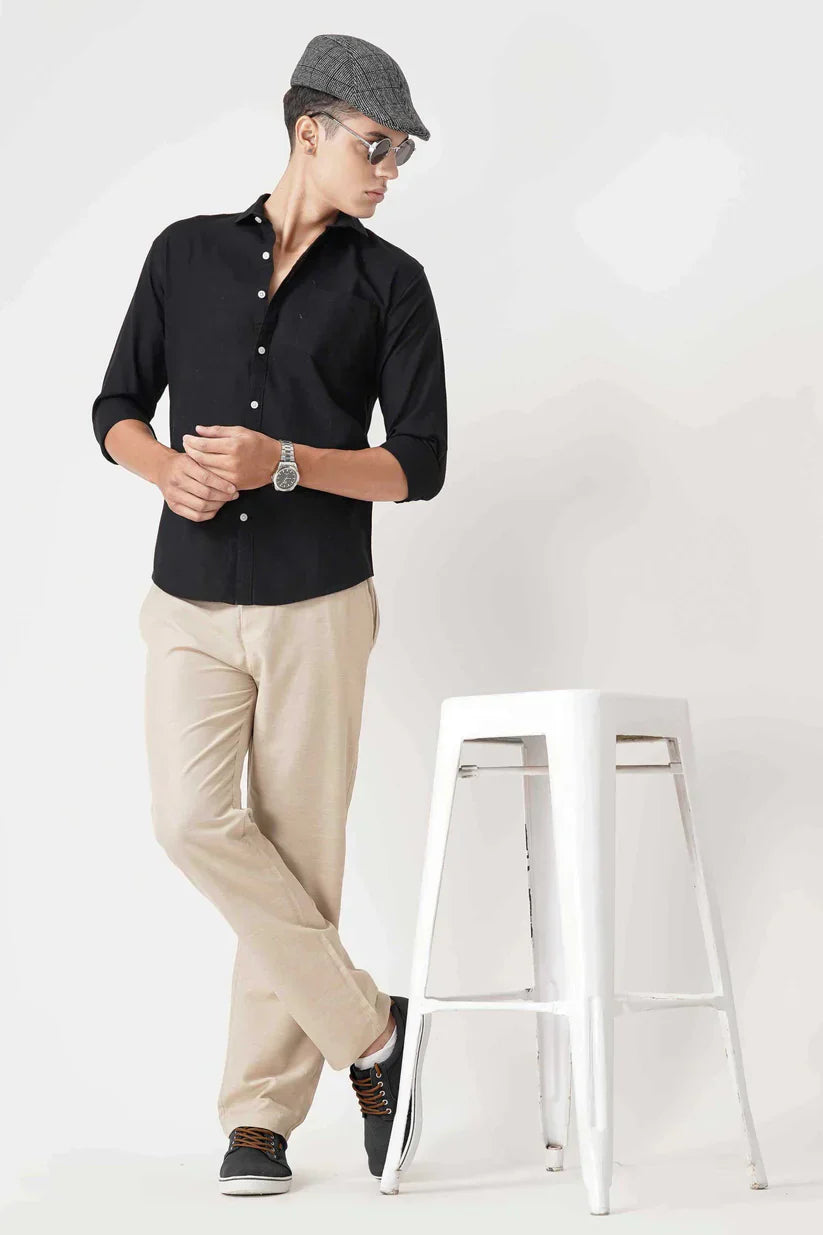 Black linen shirt made from pure fabric, suitable for any occasion.