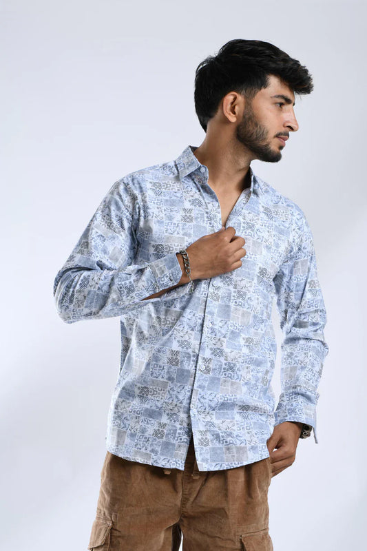 Man wearing blue floral printed shirt, stylish and comfortable design.