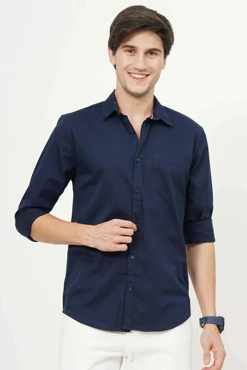 Blueish plain shirt for men made with cotton fabric.