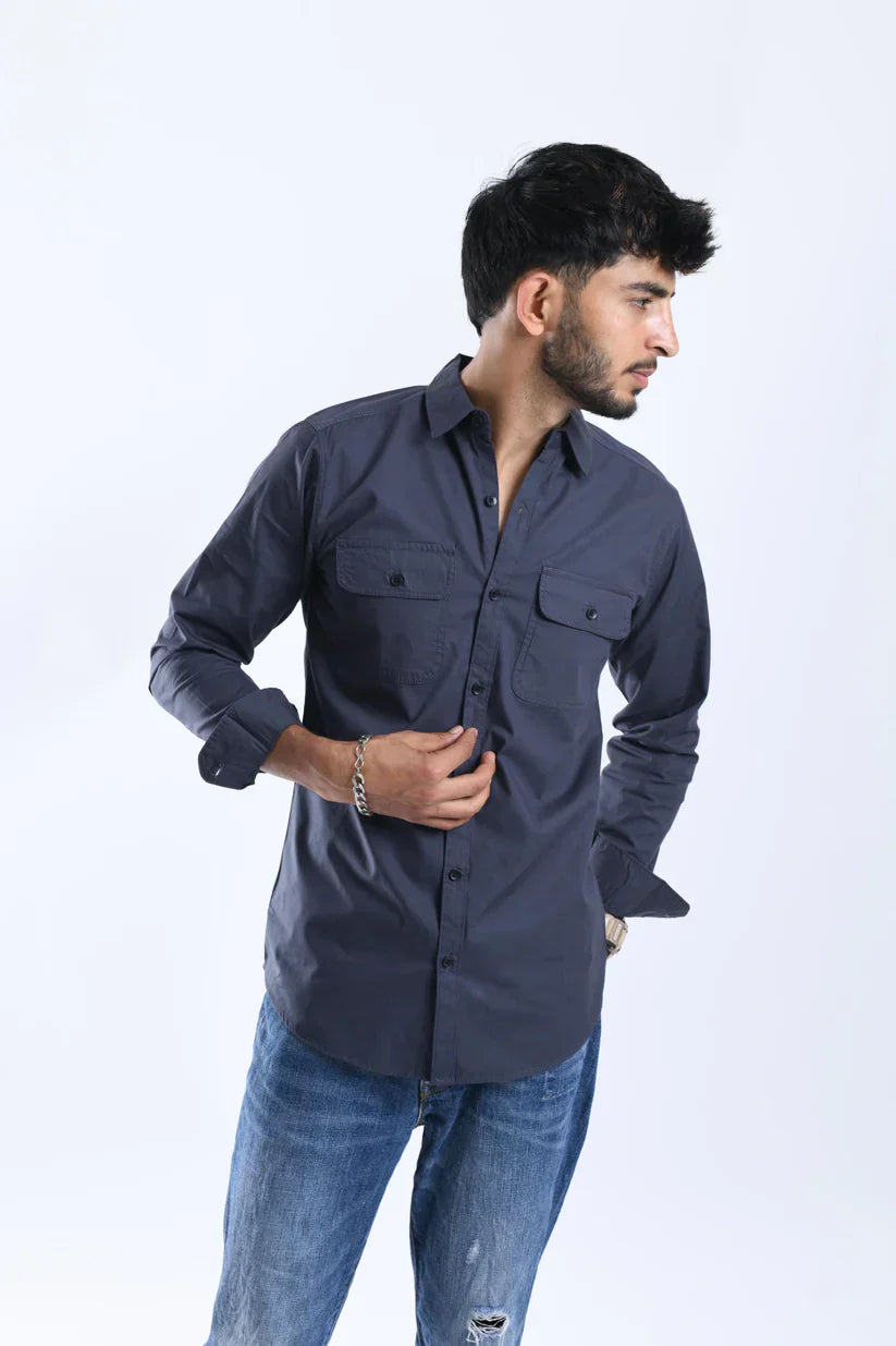 Man wearing dark grey shirt made of 100% cotton.