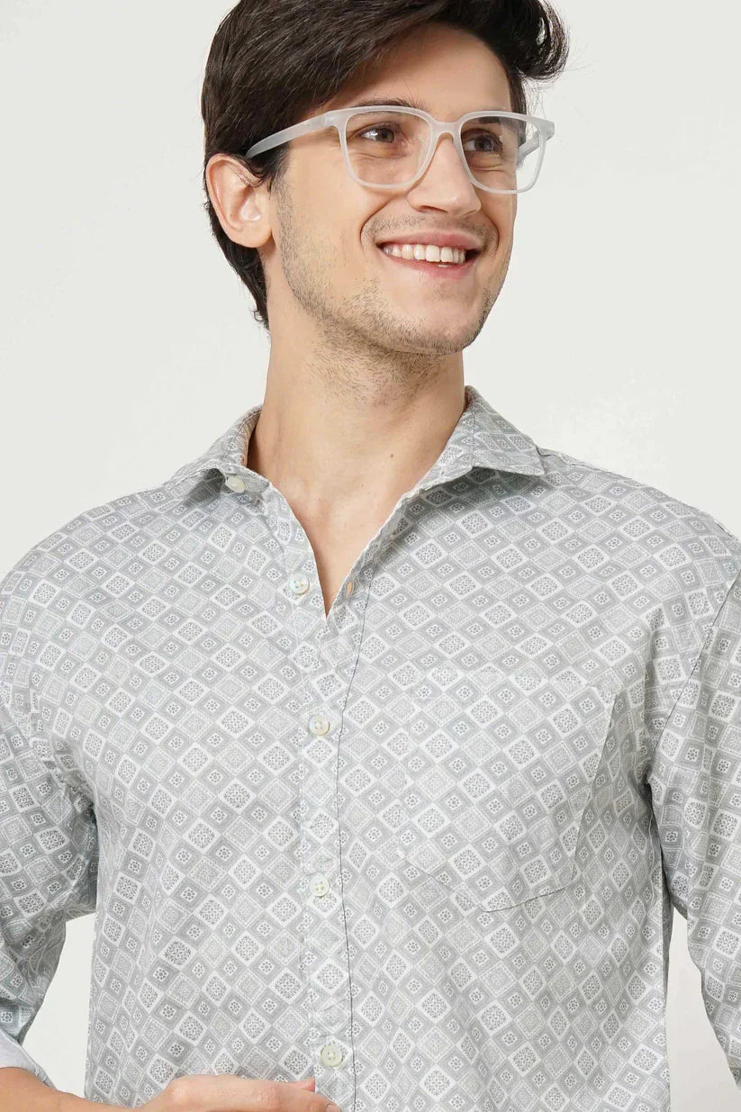 Man wearing leaf green printed shirt in 100% cotton fabric.