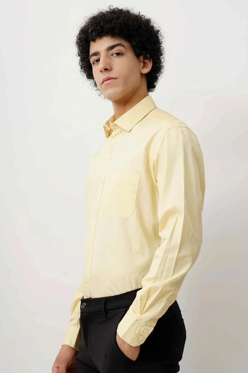 Man wearing a lime minimalist shirt made from 100% cotton for comfort.