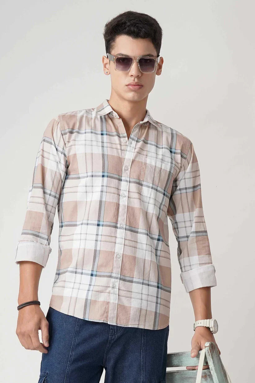 Man wearing an orange chic check shirt made of 100% cotton.