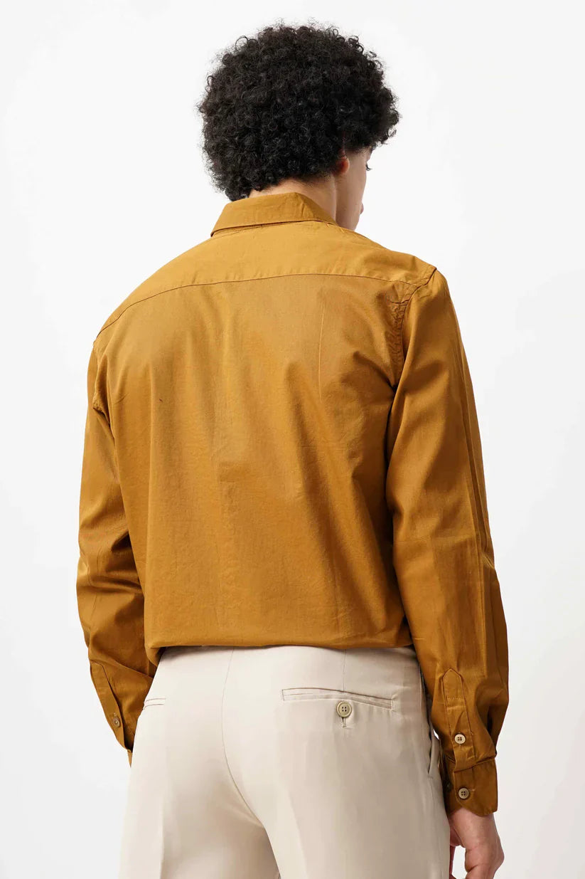 Men's tan minimalist shirt made of 100% cotton, showcasing a classic brown design.